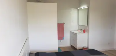 a white bedroom with a sink and a mirror at New Grand duplex avec terrasse plein sud vue piscine in Vilamoura