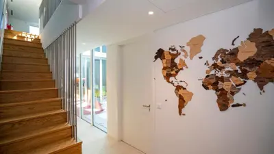 a wall mural of a map of the world on a wall at Central Vilamoura Townhouse in Quarteira