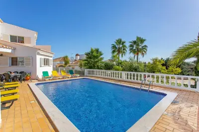 a swimming pool in the backyard of a house at Villa Ninho da Aguia by Villa Plus in Albufeira