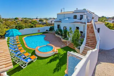 an aerial view of a house with a swimming pool at Villa Casa do Laguinho by Villa Plus in Albufeira