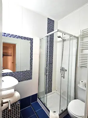 a bathroom with a shower and a toilet and a sink at Albufeira Old Town T3 with Balcony in Albufeira