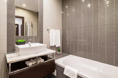 a bathroom with a white sink and a tub at ALBUFEIRA (OLD TOWN) VERASOL AA - THE LUXURY STAY in Albufeira