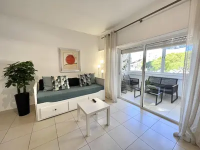 a living room with a couch and a table at Torre 20 - Near the beach - Quarteira in Quarteira