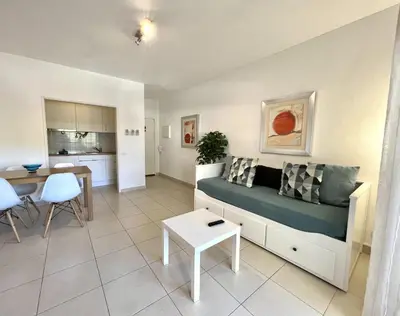 a living room with a couch and a table at Torre 20 - Near the beach - Quarteira in Quarteira