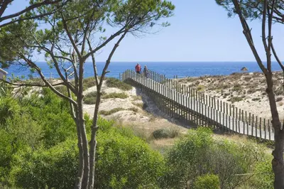 a river with a town in the distance at Sunny Acacia Apartment in Vale do Lobo