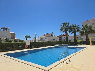 a swimming pool in front of a apartment building at Mar a Vista in Albufeira