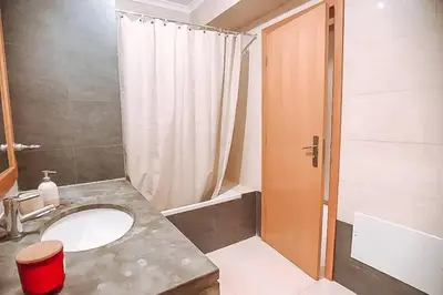 a bathroom with a sink and a shower at Plant Paradise Apartment in Albufeira