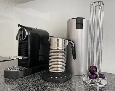 a kitchen counter with a coffee maker and a blender at Casa Rosa - Vilamoura in Vilamoura