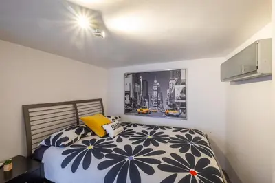 a bedroom with a bed with pillows and a window at #041 Future House by Home Holidays in Albufeira