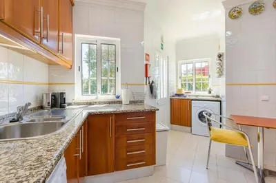 a kitchen with a sink and a dishwasher at Villa Nox in Brejos
