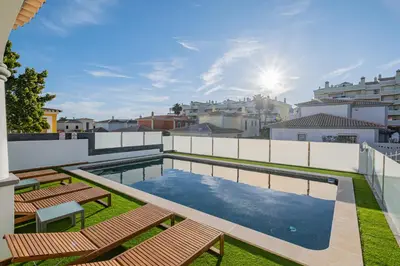 a bedroom with a bed and a mirror at Villa Thetis by Atlantic Places in Albufeira