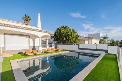 a living room with a pool table and a couch at Villa Thetis by Atlantic Places in Albufeira