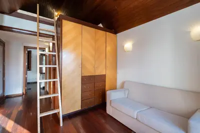 a living room with a couch and a cupboard at Holiday villa in elite residential area of Faro in Faro