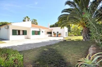 a yard with a house and a swimming pool at Close to Beaches and All Amenities, Private Pool, Free AC and Wifi in Quarteira
