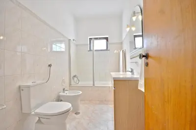 a bathroom with a sink and a toilet and a shower at Close to Beaches and All Amenities, Private Pool, Free AC and Wifi in Quarteira