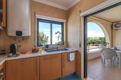 a kitchen with a sink and a window at Refugio Salgados in Galé