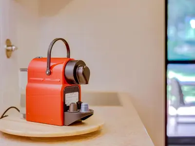 an orange toaster sitting on top of a counter at AL - Apartamento Vila Sol F5 AE in Vilamoura