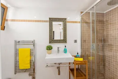 a bathroom with a sink and a shower at Villa Casa Tina by Villa Plus in Albufeira