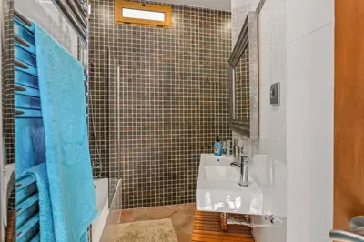 a bathroom with a sink and a shower at Villa Casa Tina by Villa Plus in Albufeira