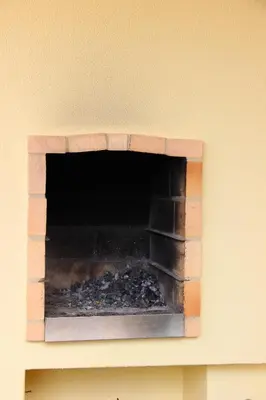 a brick fireplace on top of a wall at Charming Apartment in Vilamoura with Shared Pool - 70 m² in Vilamoura