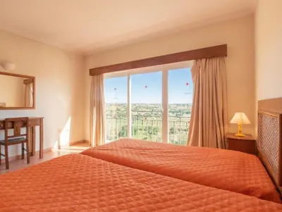 a bedroom with a bed and a large window at Villa Agua - Modern villa, quiet location walkable to restaurant and supermarket in Guia