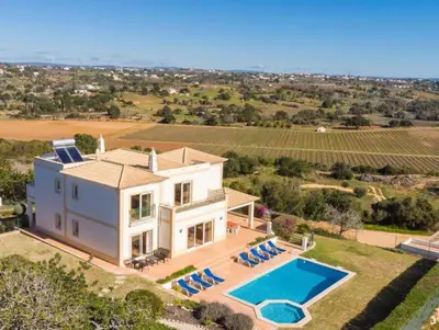 an aerial view of a house with a swimming pool at Villa Agua - Modern villa, quiet location walkable to restaurant and supermarket in Guia