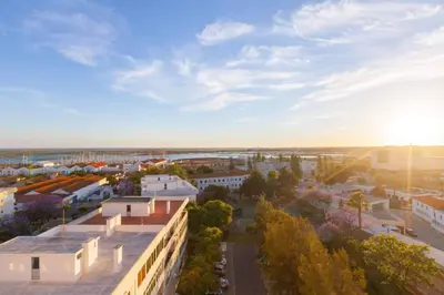 an aerial view of a city with buildings at Sunset entre a Ria e o Teatro in Faro
