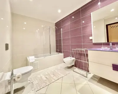 a bathroom with a toilet and a tub and a sink at Miral 1 - Apartment 100m to the beach by HD PROPERTIES - Quarteira in Quarteira