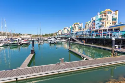 a marina with boats in the water and buildings at Casa Primavera in Albufeira