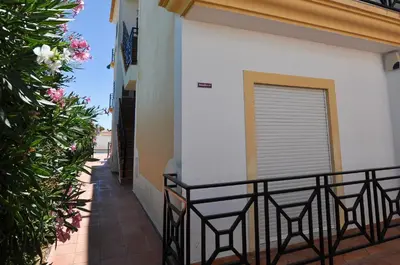 a balcony with chairs and plants on a building at Oura Sea View by OCvillas in Albufeira
