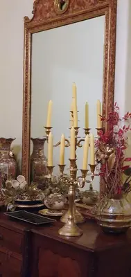 a dining room table with a black table and a clock at Villa Rosa Boutique in Almancil