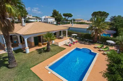 an aerial view of a house with a swimming pool at Villa Celia by Villa Plus in Olhos de Água