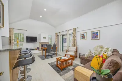 a living room with a couch and a table at Villa Eliza by Villa Plus in Albufeira