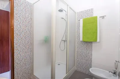 a bathroom with a shower and a toilet and a sink at Villa Gregorio by Villa Plus in Galé