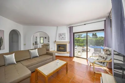 a living room with a couch and a table at Villa Casa Michelle by Villa Plus in Almancil