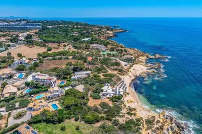 an aerial view of a house next to the ocean at Villa Praia by Villa Plus in Galé