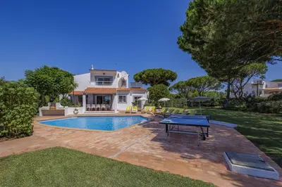 a swimming pool in the backyard of a house at Villa Uma by Villa Plus in Loulé