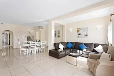 a living room with a couch and a table at Villa Uma by Villa Plus in Loulé