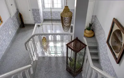 a staircase in a home with blue and white tiles at Palacete da Baixa by MY CHOICE in Faro