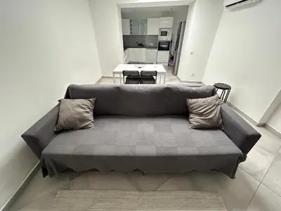 a couch in a living room with a table at Old Town House in Loulé