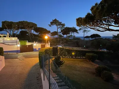 a fence with a street light next to a park at Praia da Falésia Alfa Mar Albufeira in Olhos de Água