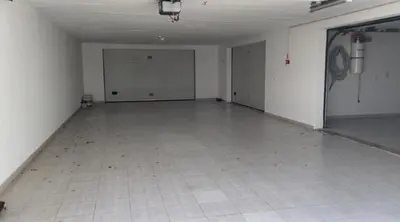 an empty room with a tile floor and white walls at Praia da Falésia Alfa Mar Albufeira in Olhos de Água
