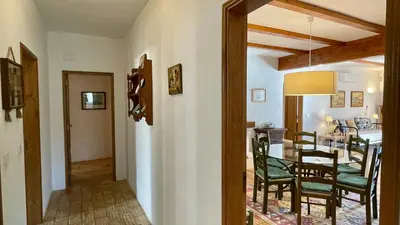 a kitchen and dining room with a table and chairs at Sol by Check-in Portugal in Vilamoura