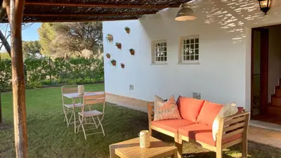a patio with a couch and a table and chairs at Sol by Check-in Portugal in Vilamoura