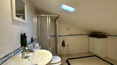 a bathroom with a toilet and a sink and a shower at Ellegance by Check-in Portugal in Vilamoura
