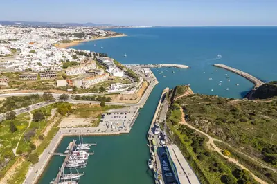 an aerial view of a harbor with boats in the water at Marina Breeze Apartment with Pool - 900m from the Beach in Albufeira