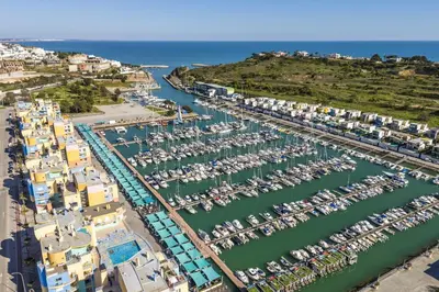 an aerial view of a harbor with boats at Marina Breeze Apartment with Pool - 900m from the Beach in Albufeira