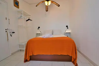a room with a kitchen with a view of the ocean at Ria Beach Studio in Faro