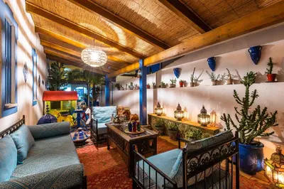 a living room with a couch and a table at Villa Oasis Galé - Luxury Villa with private pool, AC, free wifi, 5 min from the beach in Albufeira