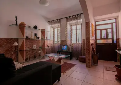 a living room with a couch and a table at ALGARVE TYPICAL DOWNTOWN HOUSE in Faro